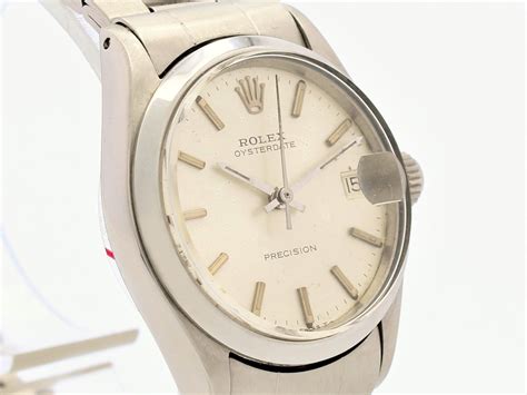 Rolex. A stainless steel and gold manual wind bracelet watch